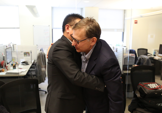 Mr. Zhang Boqing, Chairman of Beroni Group embraced with Walter Ian Lipkin, Professor of the Mailman School of Public Health of Columbia University